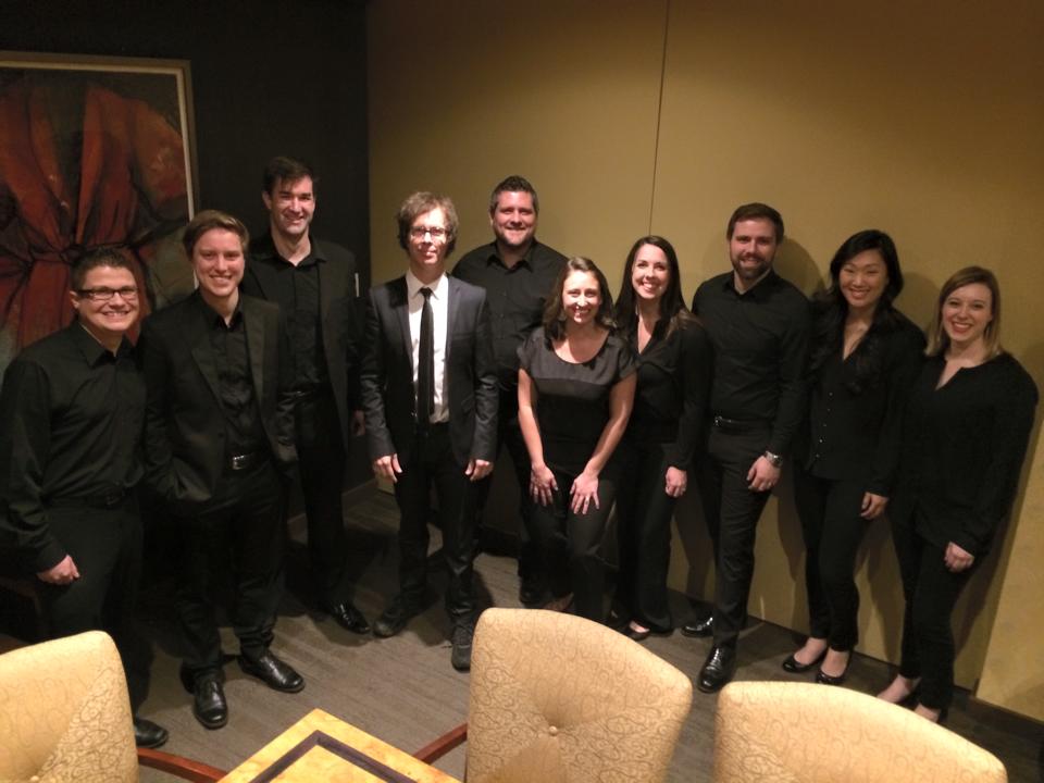 Group of people wearing all black, Ben Folds standing in the center with white shirt. Barry (with short-cropped beard) stands third from right.